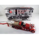 A novelty telephone in the style of a vintage Fire Engine,