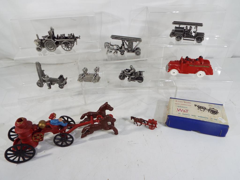 Nine vintage fire engine related models, predominantly horse drawn,