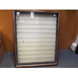 Side opening wooden display unit, with 10 glass shelves. Measures H83cm x W66cm x D13cm.