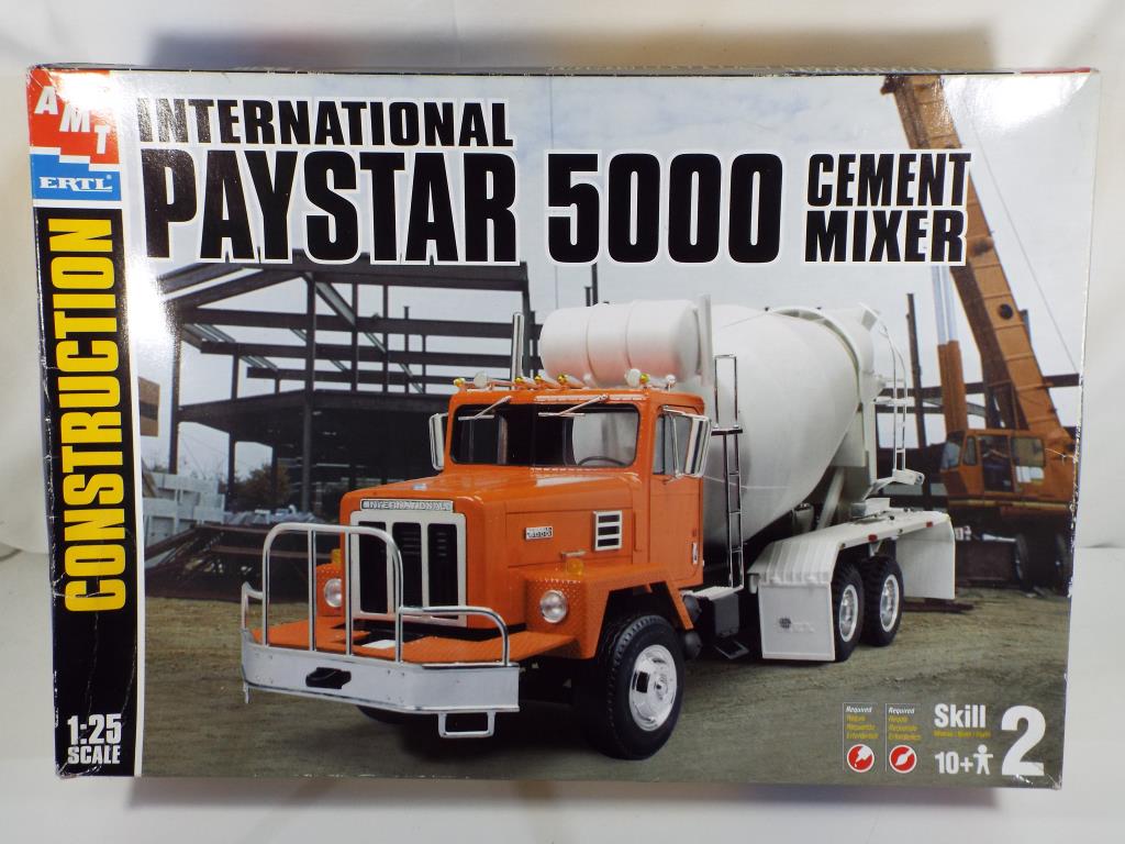 AMT - 1:25 scale model kit containing an International Paystar 5000 cement mixer box G items appear
