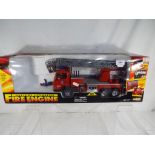 A battery operated Fire Engine by Everbright Toys, sound and light, working ladder # 29688, m in b,