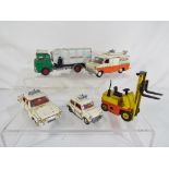 Dinky Toys - five unboxed playworn diecast models by Dinky Toys comprising a Police Ford Transit