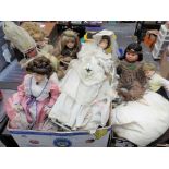 Dolls - Two boxes containing a large quantity of modern dressed dolls and other.