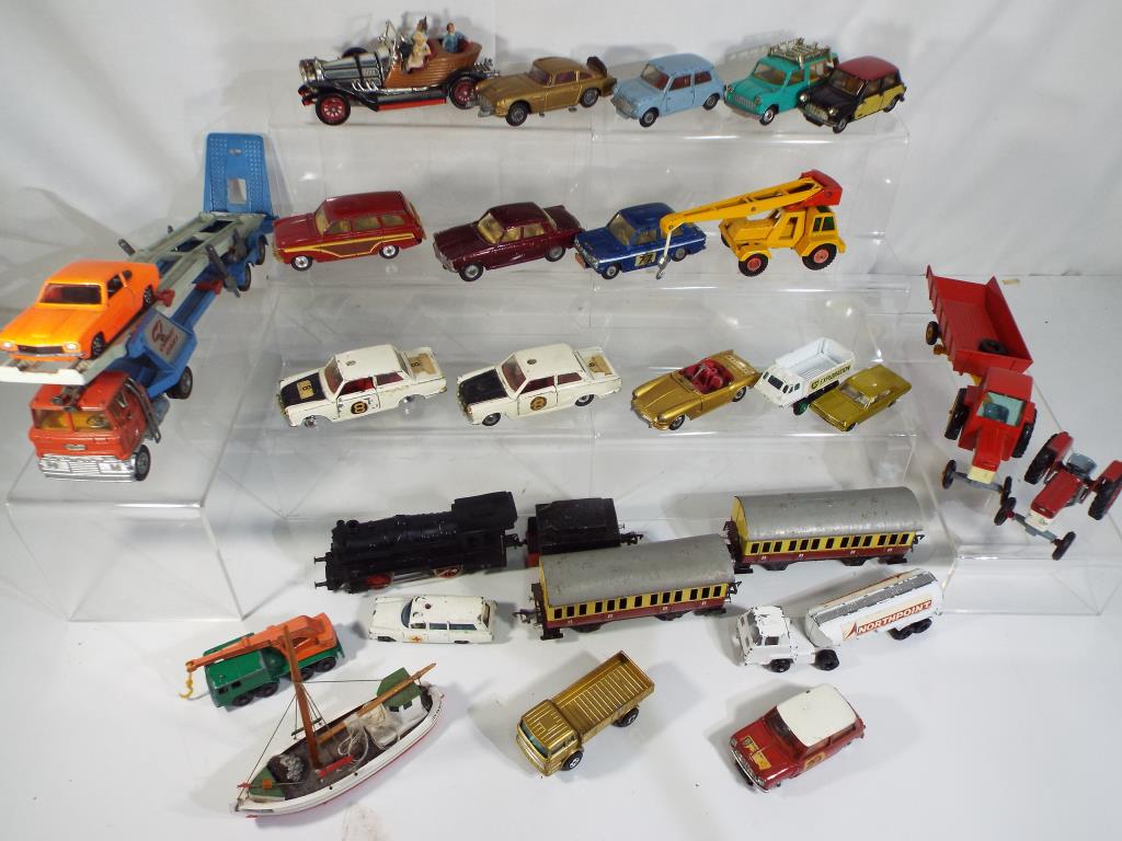 Corgi, Dinky and Matchbox - twenty three good playworn, unboxed diecast vehicles,