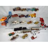 Corgi, Dinky and Matchbox - twenty three good playworn, unboxed diecast vehicles,