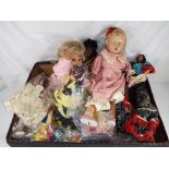 Dolls - ten dressed world costume dolls, a child's crawling doll marked to the back of the neck FS,