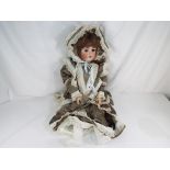 Dolls - a German bisque headed jointed dressed doll, approx 80cm (h) with glass sleeping eyes,