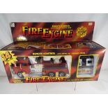 A remote control, battery operated model Fire Engine by Thaitoy, 14 functions,