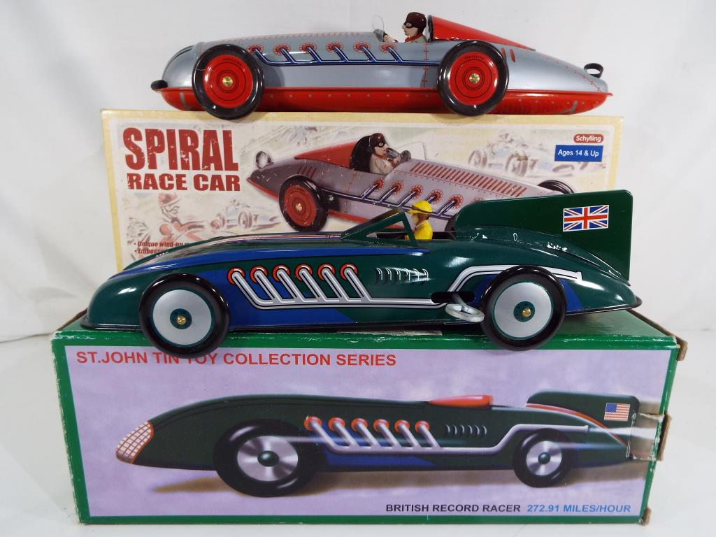 Two modern tin-plate cars in original boxes by St John featuring a British record racer and a