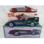 Two modern tin-plate cars in original boxes by St John featuring a British record racer and a
