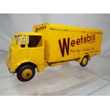 Dinky - a Guy Weetabix delivery truck, condition vg front axle is loose.