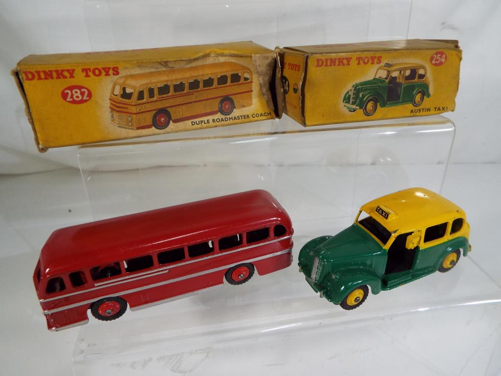 Dinky Toys - two diecast models comprising a Duple Roadmaster Coach painted in red with silver