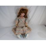 Dolls - a large bisque headed doll with sleeping glass eyes, open mouth and ceramic teeth,