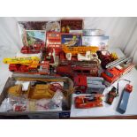 Fire Engines - A good selection of plastic, tinplate and ceramic fire related vehicles,