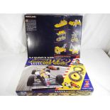 Meccano and Tyco - two boxed sets comprising a family Tyco slot racing set and a Meccano #6 set,