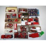 In excess of thirty fire vehicles, mainly white metal kit built,