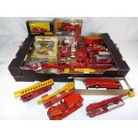 Solido, Tekno, Corgi and others - In excess of thirty diecast fire vehicles,