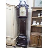 A small reproduction chiming grandfather clock with brass and silver dial in mahogany case