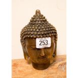 A heavy bronze Buddha head paperweight