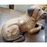 A life size carved wooden dog