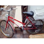 Red and white Springfield lady's bicycle with front and rear rack