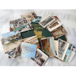 A large collection of postcards and a book 'Pictures of Life Character' by John Leech