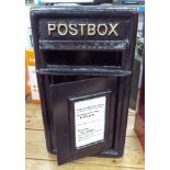 A black reproduction cast iron post office box