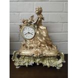 A modern French style gilt figure mounted mantle clock