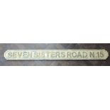 A large approx 4' long wooden 'Seven Sisters Road N15' sign