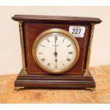 An Edwardian mantel clock in inlaid mahogany and brass pillar case