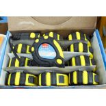 A box of 12 5mtr tape measures