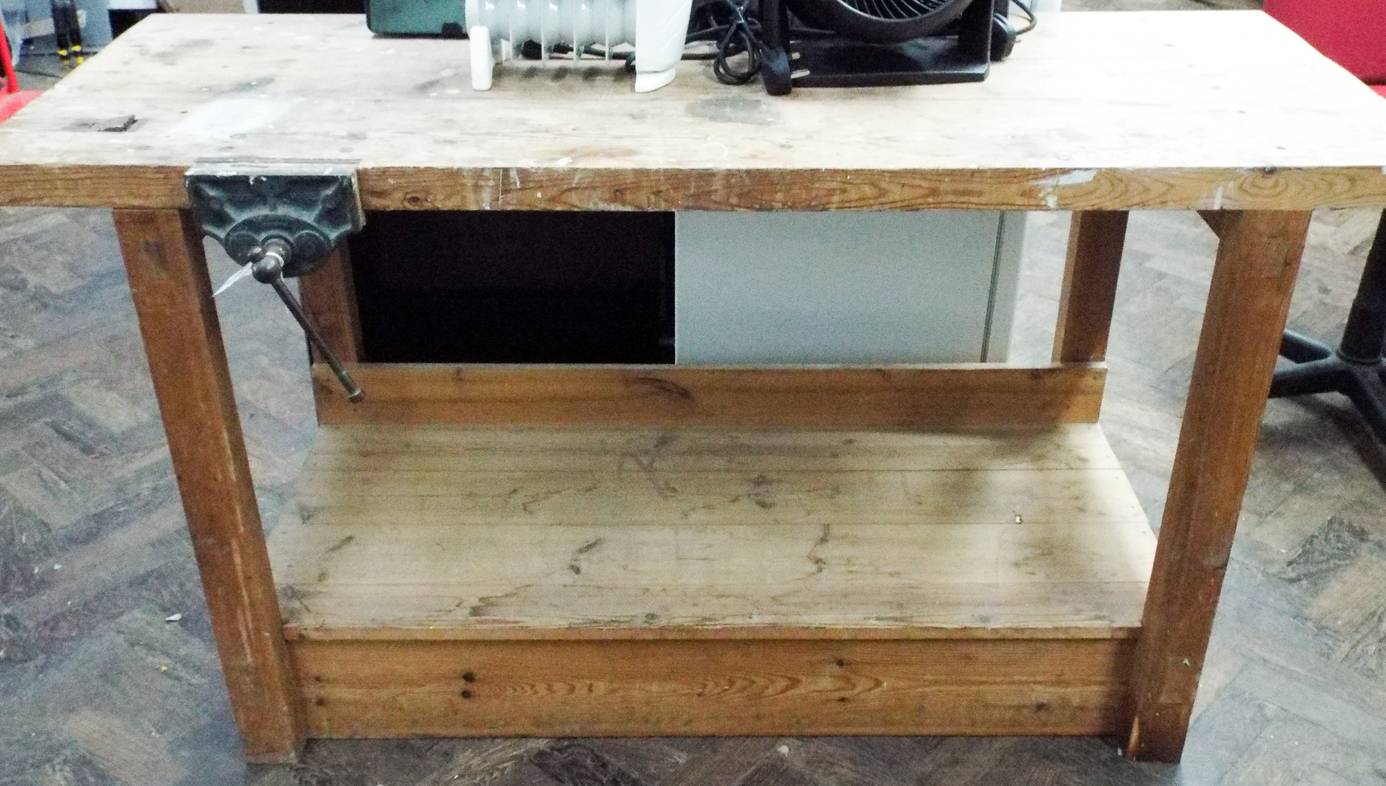 A heavy duty work bench with shelf under and vice etc Approx 32 inches tall,