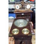 A small CD rack, a fisherman barometer, clock, storage box,