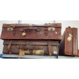 Two large old leather suitcases and two smaller leather suitcases