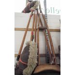 A pair of old wooden crutches and two hobby horses
