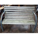 A metal ended wooded garden bench