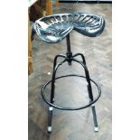 A cast iron adjustable tractor seat stool in black