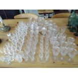 A large quantity of assorted wine glasses