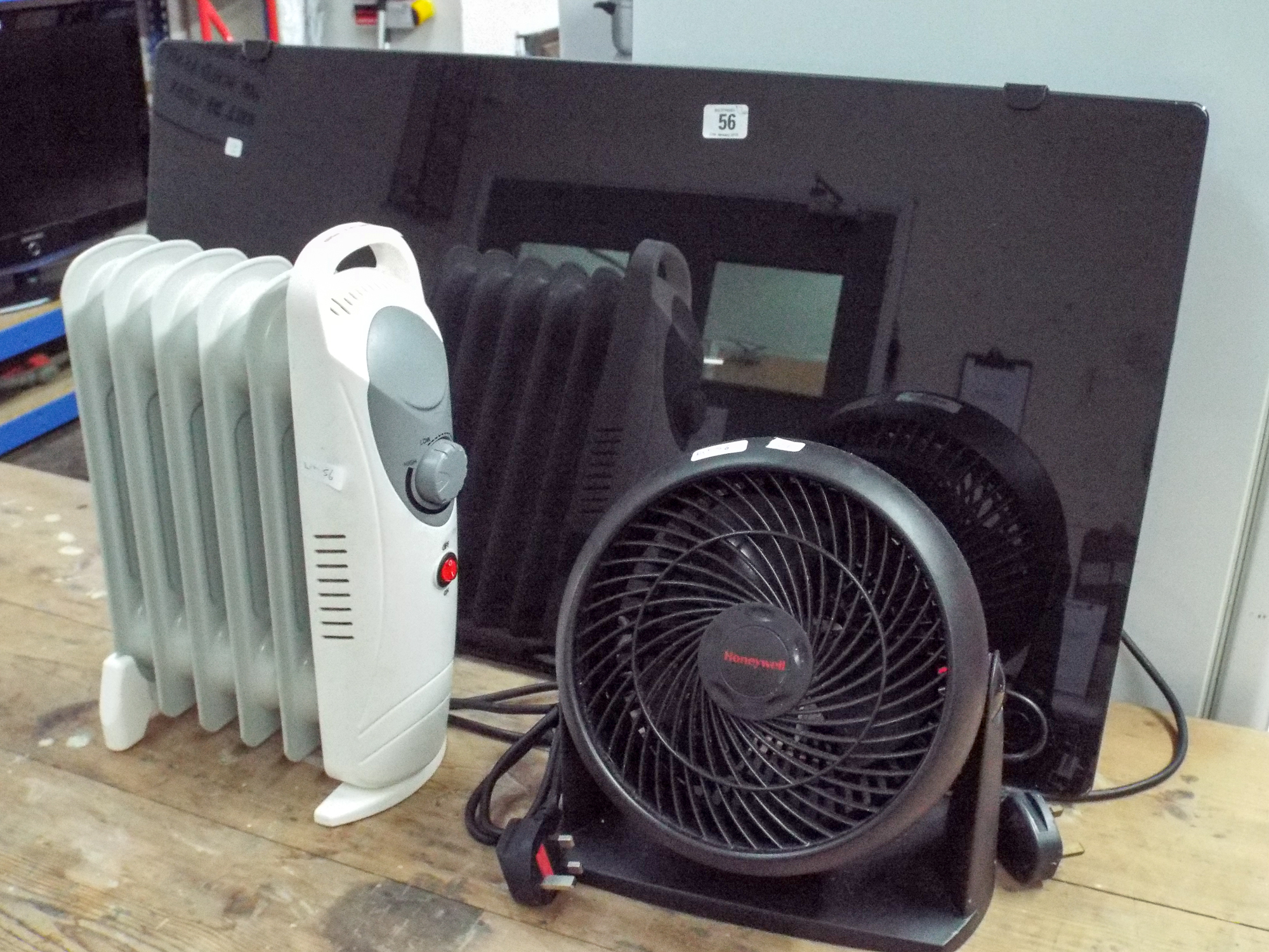 A modern black radiator style heater,