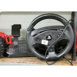 A PS4 steering wheel with pedals