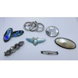 A collection of silver brooches, oval rock crystal brooch,
