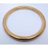 A 9ct rose gold slave bangle, gross weight 30.
