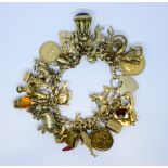 A charm bracelet gross weight 152gms - set 29 charms,