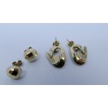 9ct yellow gold swan design earrings and a pair of yellow gold ear studs gross weight 5.