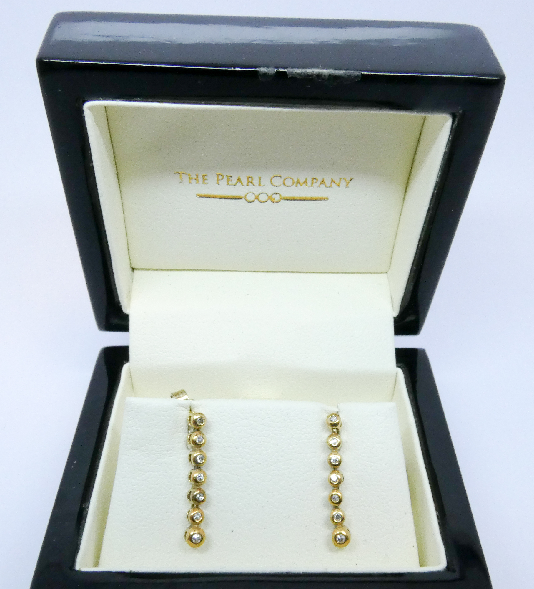Three pairs of modern diamond set earrings,