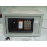 A new electronic combination safe with key and instructions