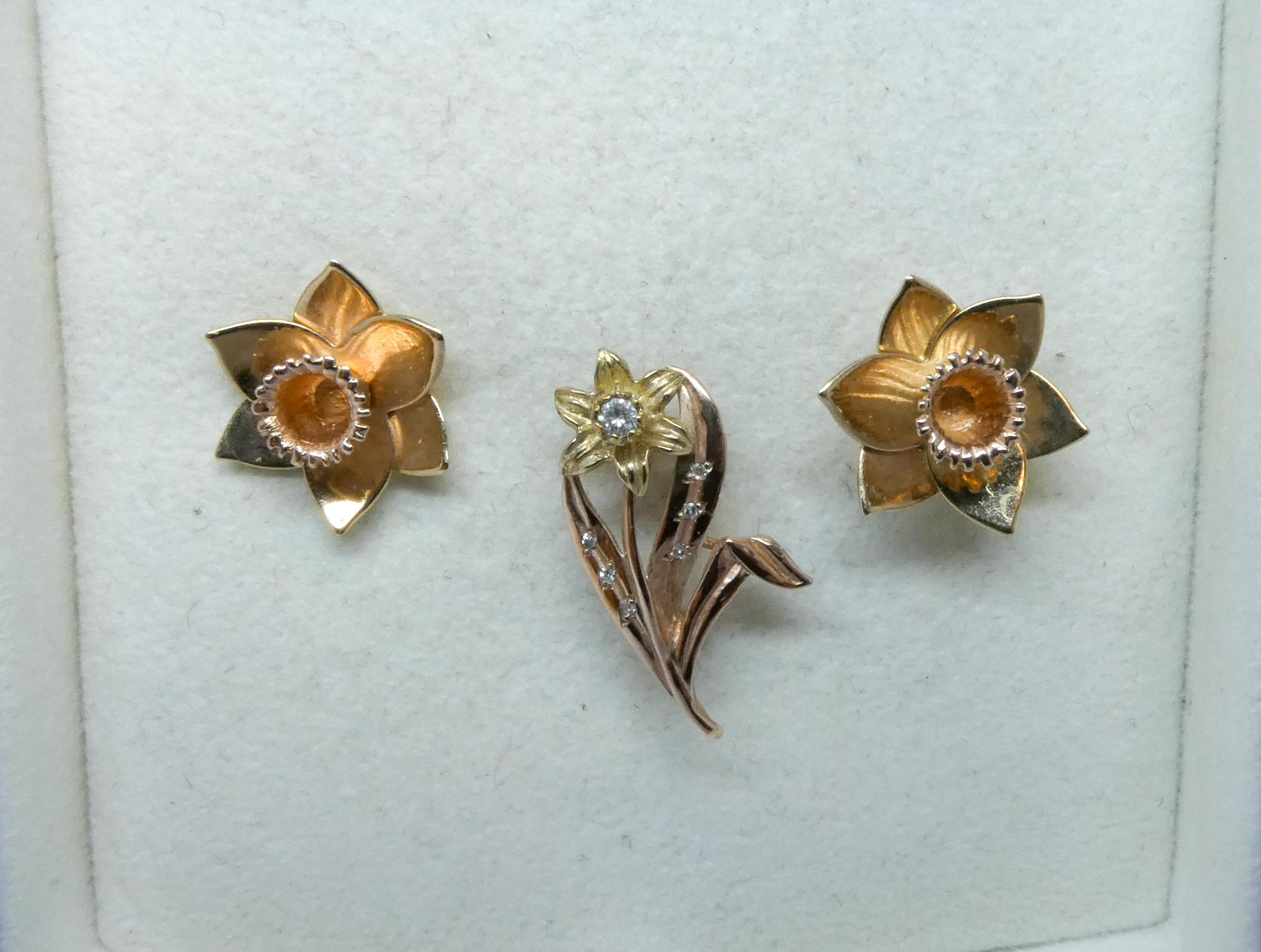 Clogau rose gold daffodil ear studs and a diamond set daffodil brooch