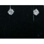 A pair of solitaire diamond ear studs set in white gold approx 25pts each
