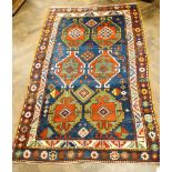 A Kazak style geometric designed wool pile rug 6'6 x 4'