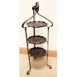 An Arts and crafts three tier metal cake stand